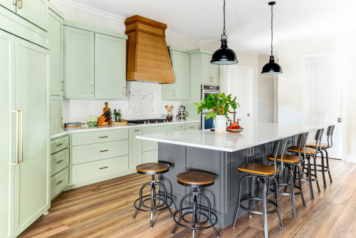 Mint green and charcoal RTA Cabinet Colors with wood accents highlight the role of finish and material in kitchen design