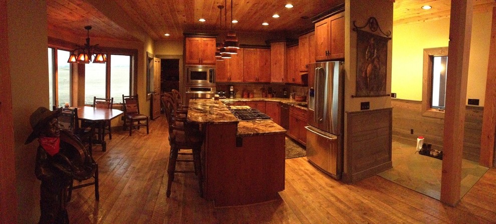 Example of a large trendy galley medium tone wood floor eat-in kitchen design in Atlanta with recessed-panel cabinets, medium tone wood cabinets, granite countertops, stainless steel appliances and an island