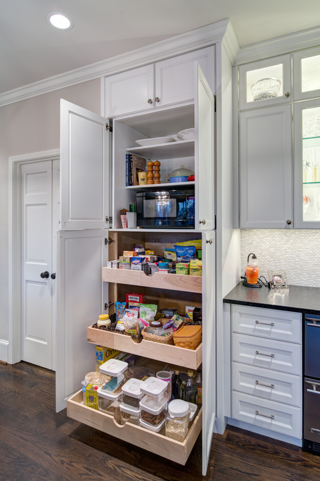Design ideas for a classic kitchen pantry in Atlanta with recessed-panel cabinets, white cabinets and dark hardwood flooring.