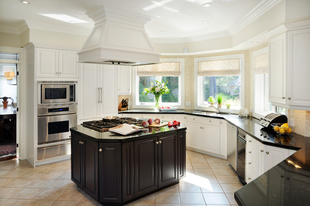 Photo of an expansive traditional u-shaped kitchen/diner in Toronto with a submerged sink, raised-panel cabinets, white cabinets, granite worktops, beige splashback, mosaic tiled splashback, integrated appliances and an island.