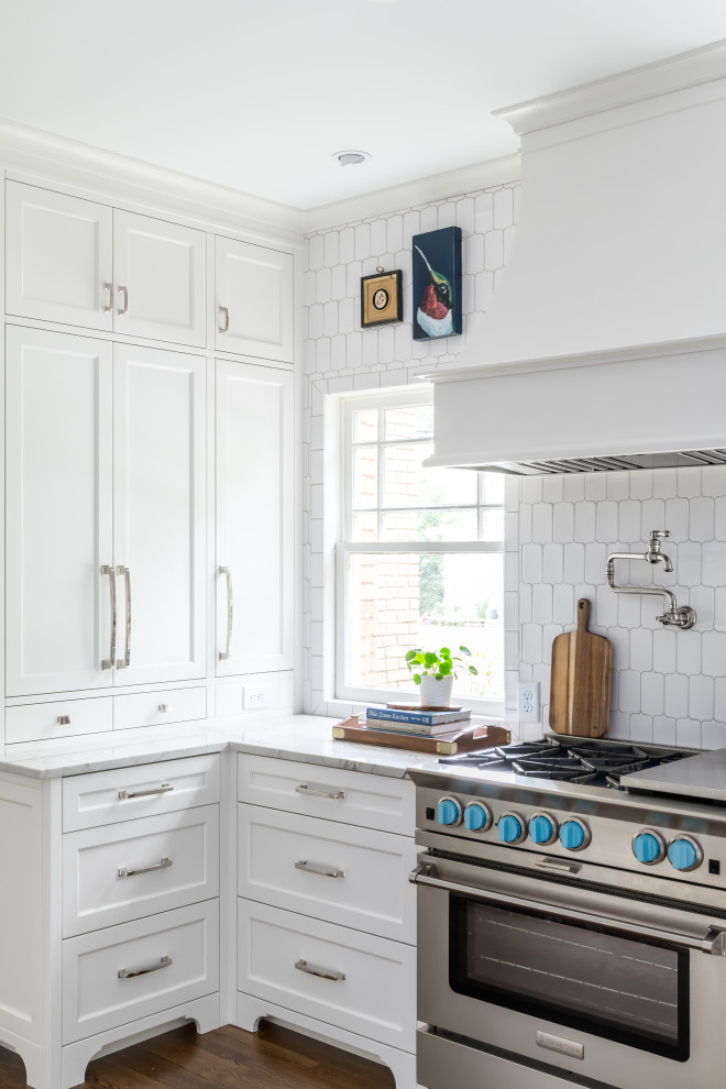 Large beach style galley dark wood floor and brown floor eat-in kitchen photo in Atlanta with an undermount sink, shaker cabinets, white cabinets, quartzite countertops, white backsplash, marble backsplash, paneled appliances, an island and white countertops