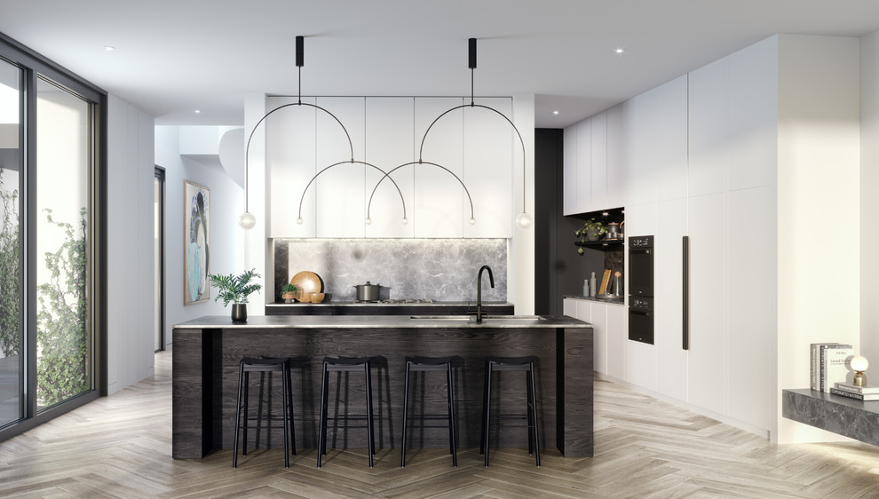 Large contemporary kitchen in Melbourne with a submerged sink, flat-panel cabinets, white cabinets, marble worktops, grey splashback, marble splashback, black appliances, light hardwood flooring, an island, grey floors and grey worktops.
