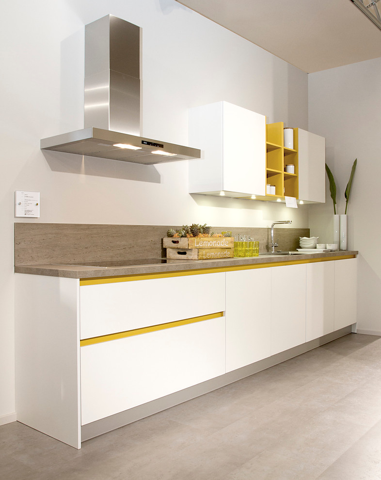 This is an example of a medium sized modern u-shaped kitchen in Other with white cabinets, laminate countertops, blue splashback, stone tiled splashback, white appliances and dark hardwood flooring.