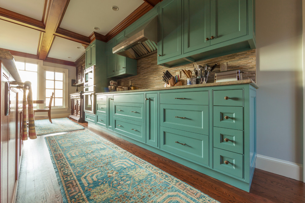 This is an example of a large traditional single-wall kitchen/diner in Portland Maine with a single-bowl sink, shaker cabinets, blue cabinets, granite worktops, brown splashback, glass tiled splashback, stainless steel appliances, an island and turquoise worktops.