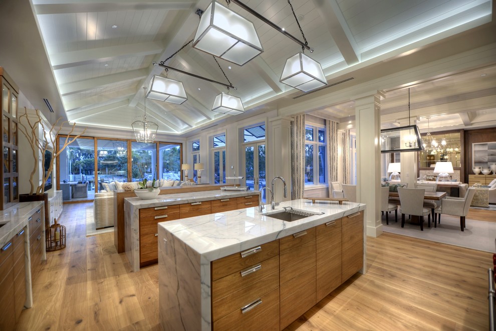 Example of an island style kitchen design in Tampa
