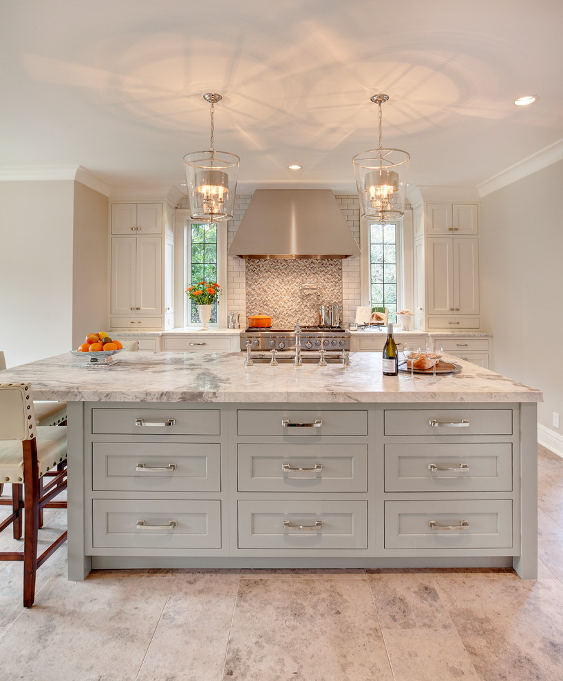 Inspiration for a transitional kitchen remodel in Seattle with an island and white countertops