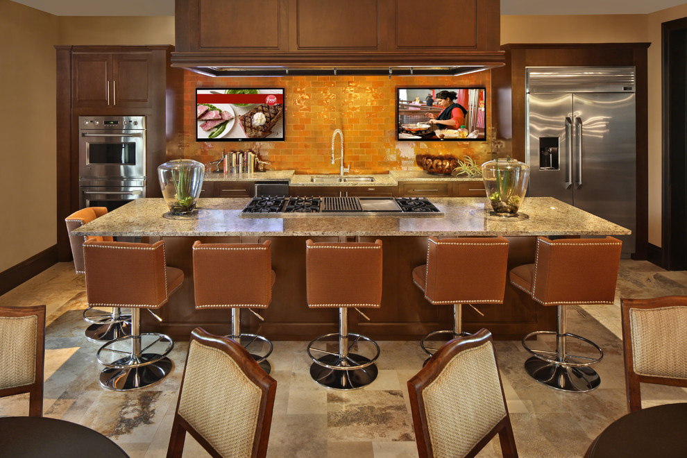 Contemporary galley kitchen in Miami with orange splashback, metro tiled splashback and stainless steel appliances.
