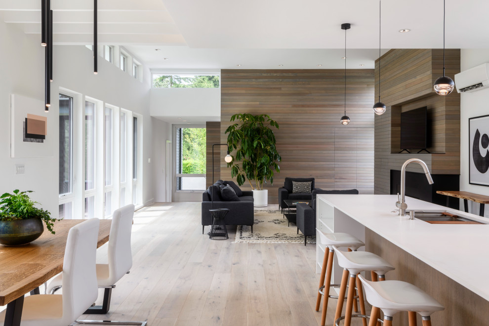 Medium sized modern kitchen in Seattle with light hardwood flooring and white floors.