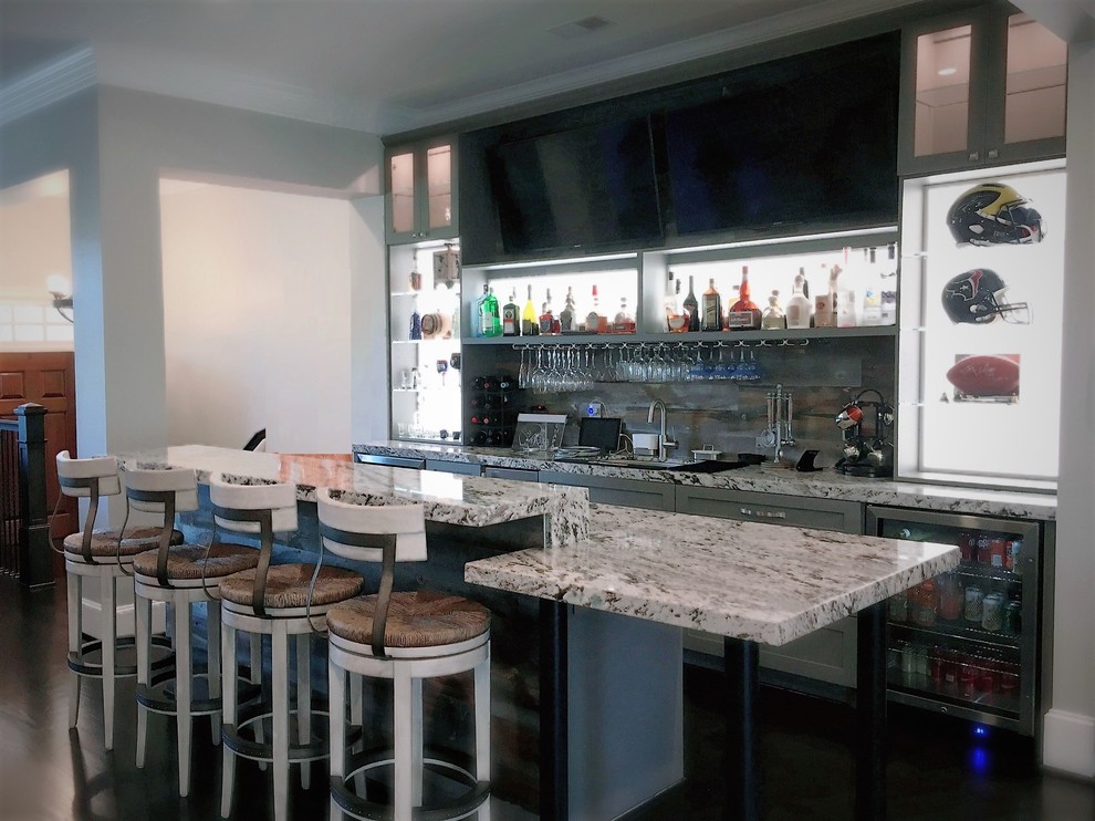 Mid-sized elegant l-shaped dark wood floor home bar photo in Houston with shaker cabinets, gray cabinets, granite countertops, gray backsplash and wood backsplash