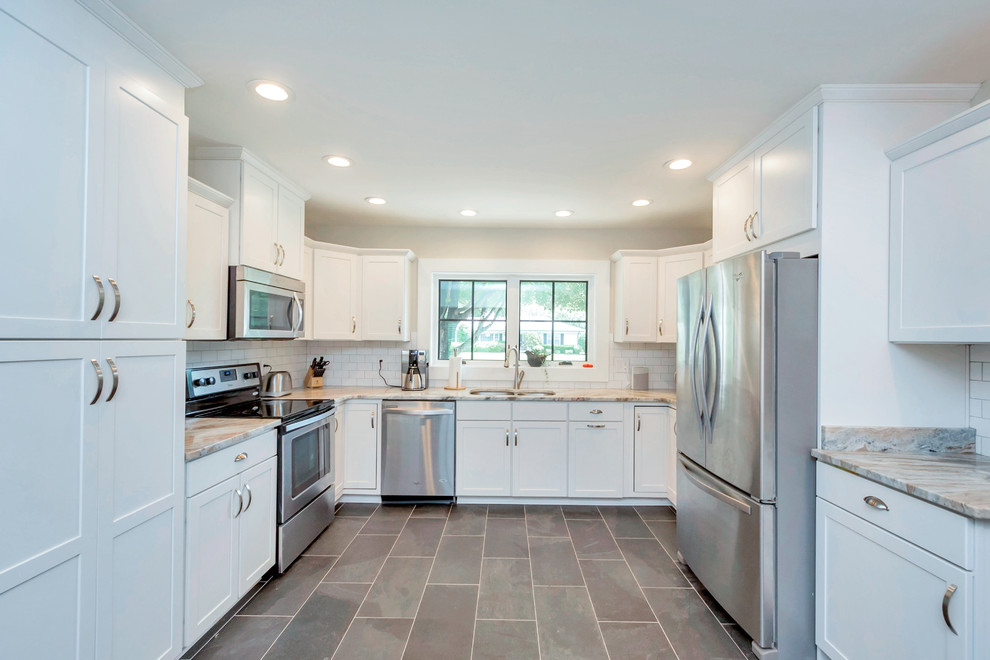 Enclosed kitchen - mid-sized contemporary u-shaped porcelain tile and gray floor enclosed kitchen idea in DC Metro with an undermount sink, shaker cabinets, white cabinets, granite countertops, white backsplash, subway tile backsplash, stainless steel appliances, no island and gray countertops