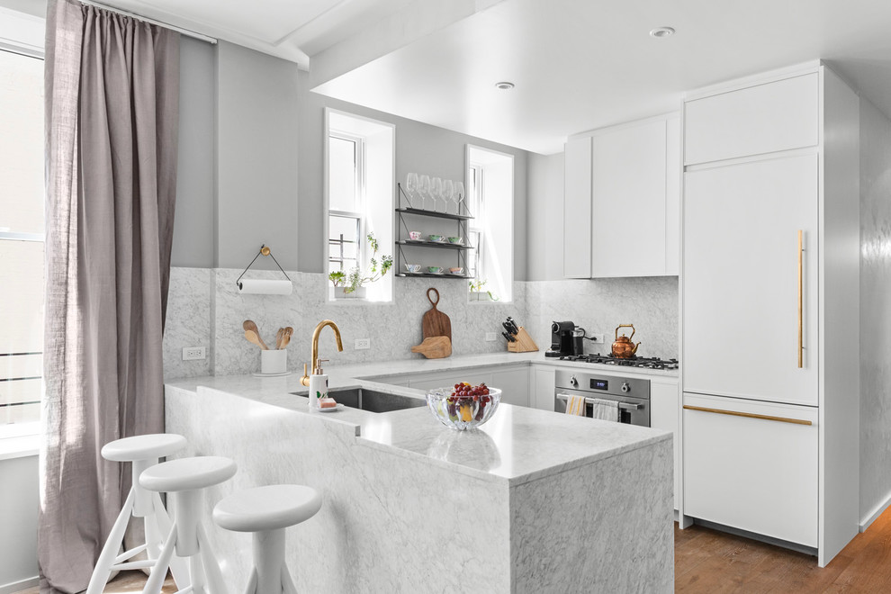 Design ideas for a traditional kitchen in New York with marble worktops and marble splashback.