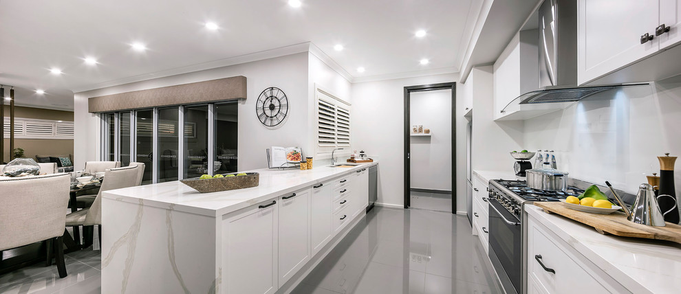 Inspiration for a medium sized traditional galley kitchen pantry in Newcastle - Maitland with a double-bowl sink, shaker cabinets, white cabinets, quartz worktops, grey splashback, glass sheet splashback, stainless steel appliances and no island.