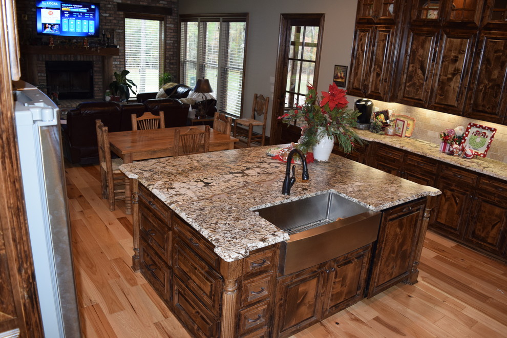 Brushed Normandy Granite Rustic Kitchen New Orleans by Sheppard
