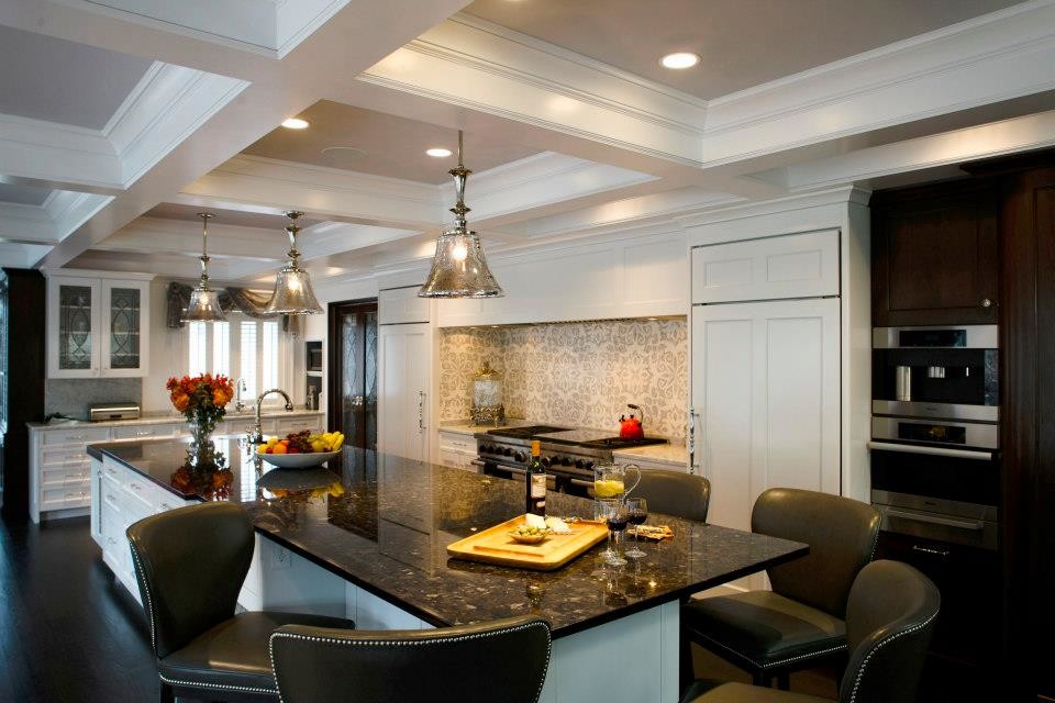 Large elegant l-shaped dark wood floor and brown floor open concept kitchen photo in Philadelphia with an undermount sink, recessed-panel cabinets, white cabinets, granite countertops, mosaic tile backsplash, paneled appliances, an island and gray backsplash
