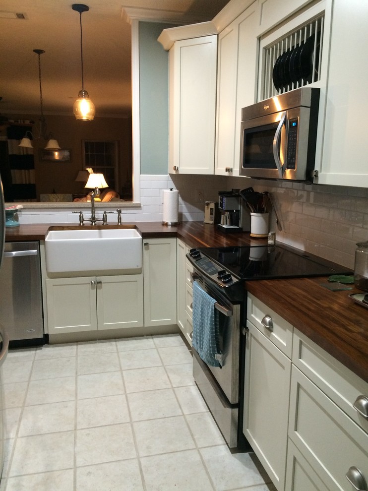 Photo of a small beach style l-shaped kitchen in Other.