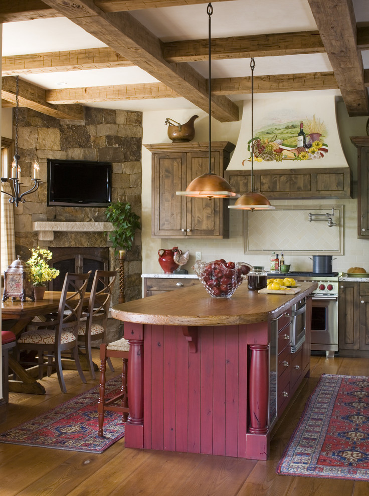 Inspiration for a rustic kitchen remodel in Denver with stainless steel appliances and wood countertops