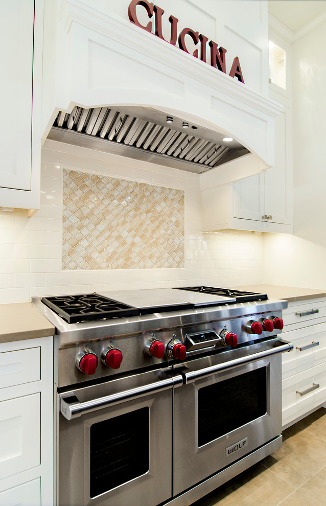 Transitional u-shaped eat-in kitchen photo in Dallas with an undermount sink, shaker cabinets, white cabinets, granite countertops, beige backsplash and stainless steel appliances