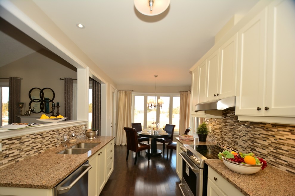 This is an example of a medium sized contemporary galley kitchen/diner in Toronto with a double-bowl sink.