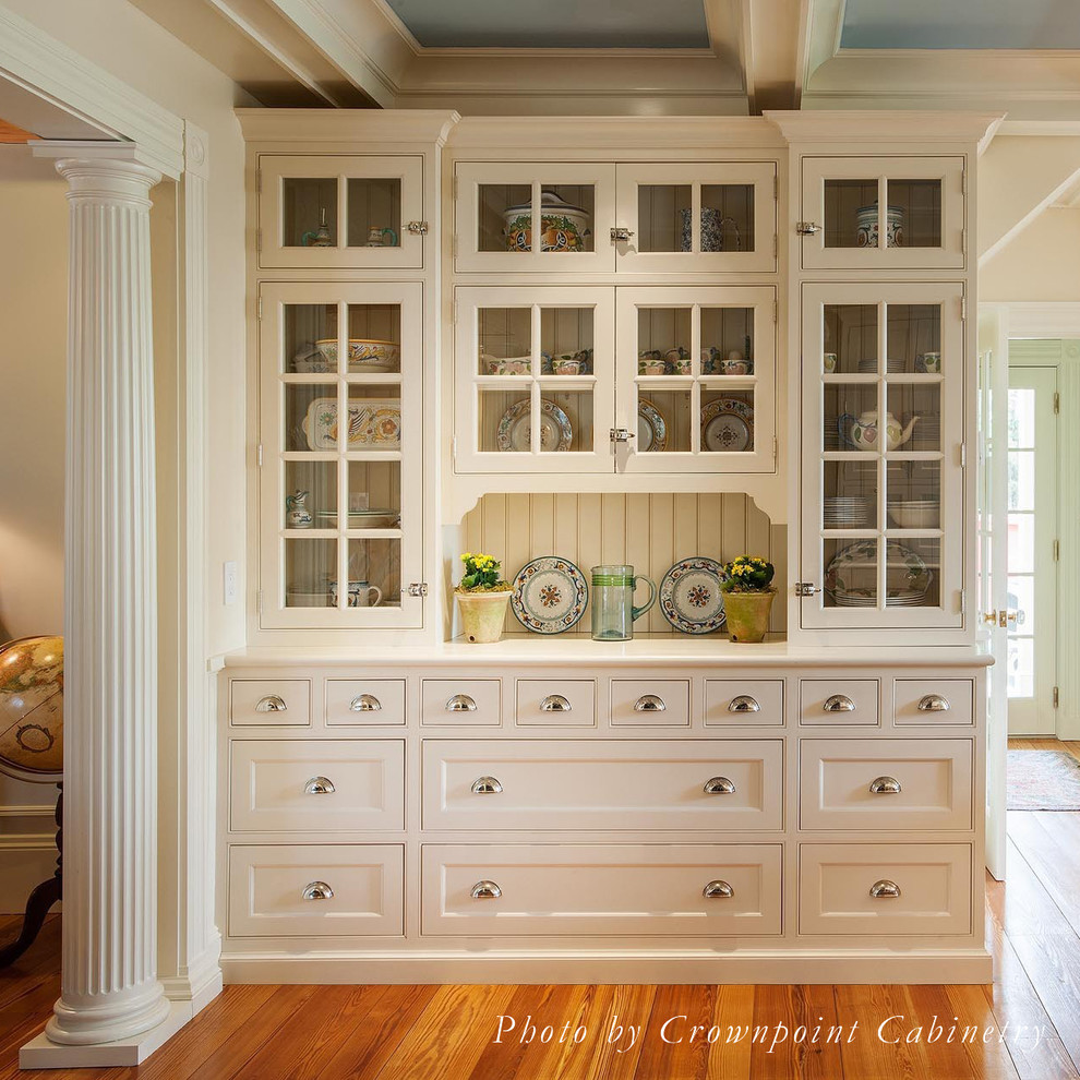 Open concept kitchen - mid-sized traditional light wood floor open concept kitchen idea in Boston with a farmhouse sink, beaded inset cabinets, white cabinets, marble countertops, white backsplash, ceramic backsplash, paneled appliances and an island