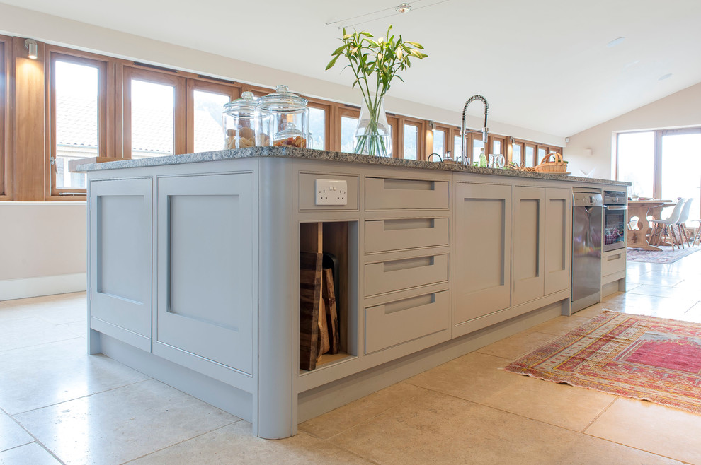 Design ideas for a medium sized traditional open plan kitchen in Other with an integrated sink, shaker cabinets, blue cabinets, granite worktops, stainless steel appliances, porcelain flooring and an island.