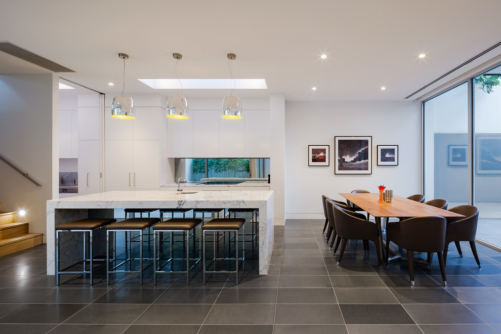 Contemporary galley kitchen/diner in Melbourne with an island.
