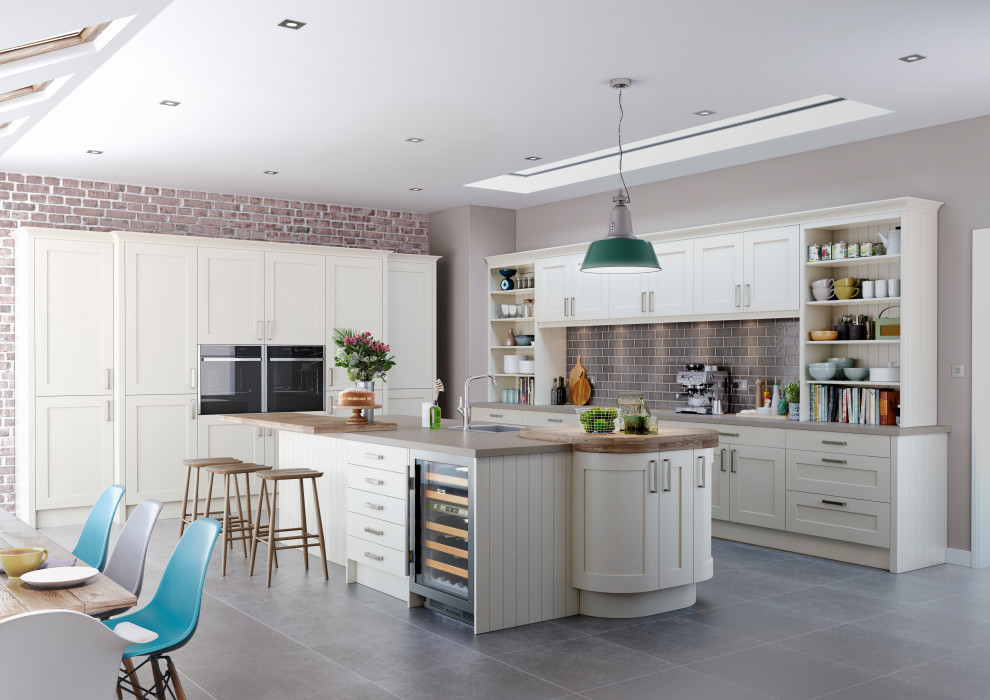 Traditional kitchen/diner in Other with shaker cabinets, beige cabinets, grey splashback, an island and beige worktops.