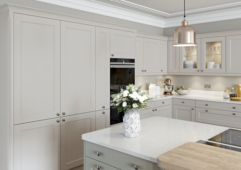 This is an example of a classic kitchen/diner in Other with beaded cabinets, beige cabinets, grey splashback, an island and white worktops.