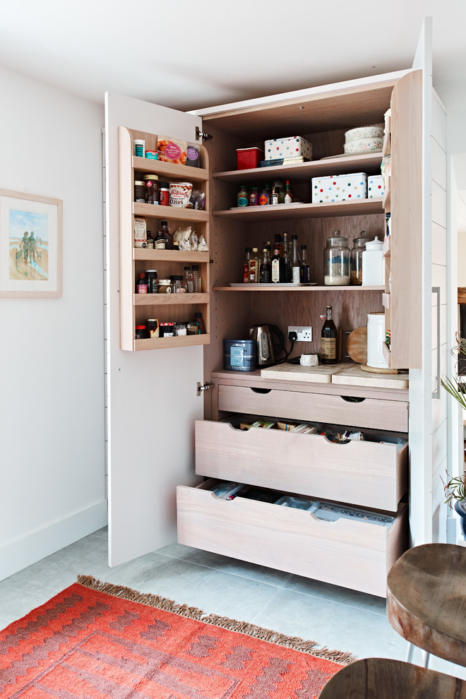 Scandinavian kitchen pantry in Berkshire with open cabinets and light wood cabinets.