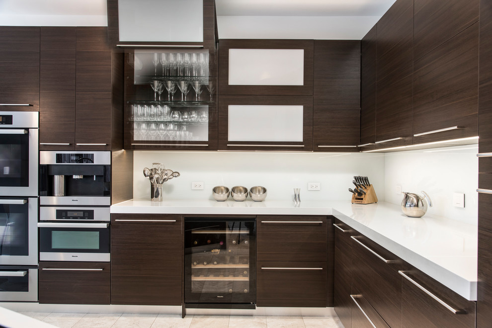 This is an example of a contemporary l-shaped kitchen in Chicago with flat-panel cabinets, brown cabinets, white splashback and stainless steel appliances.