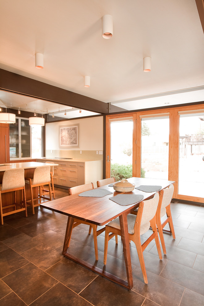 Inspiration for a modern kitchen/diner in Denver with flat-panel cabinets, light wood cabinets and beige splashback.