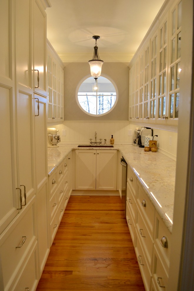 Small traditional galley kitchen pantry in Atlanta with a single-bowl sink, white cabinets, granite worktops, white splashback, stainless steel appliances, light hardwood flooring and no island.