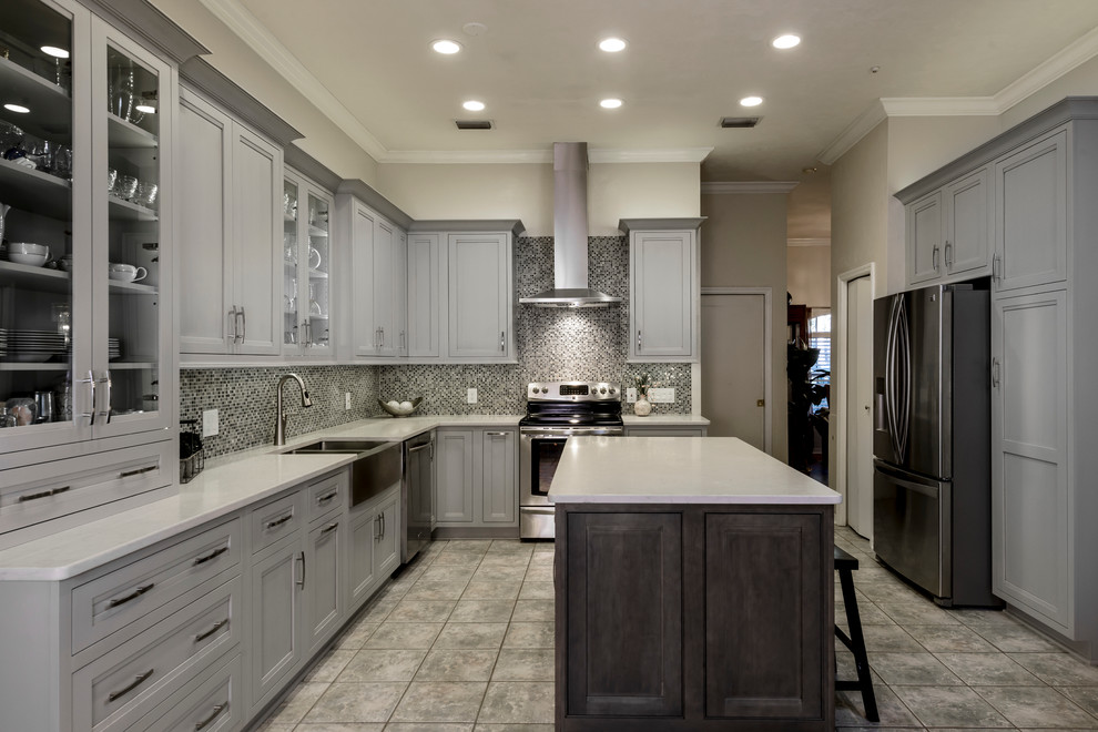 Example of a transitional porcelain tile enclosed kitchen design in Jacksonville with a farmhouse sink, flat-panel cabinets, gray cabinets, quartz countertops, multicolored backsplash, mosaic tile backsplash and stainless steel appliances