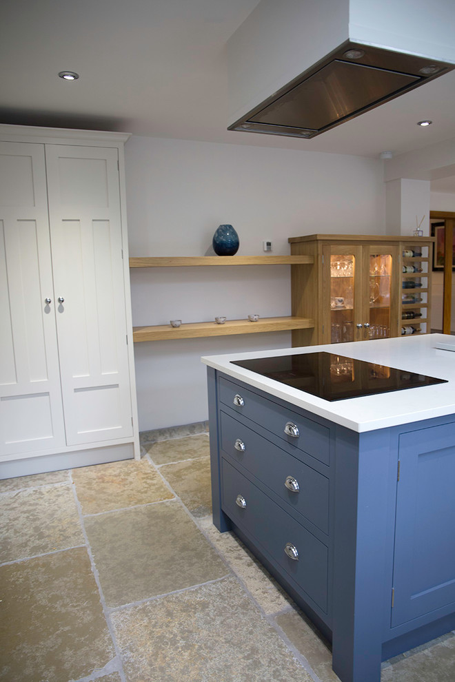 Photo of a classic u-shaped open plan kitchen in Cheshire with shaker cabinets, blue cabinets, quartz worktops and multiple islands.