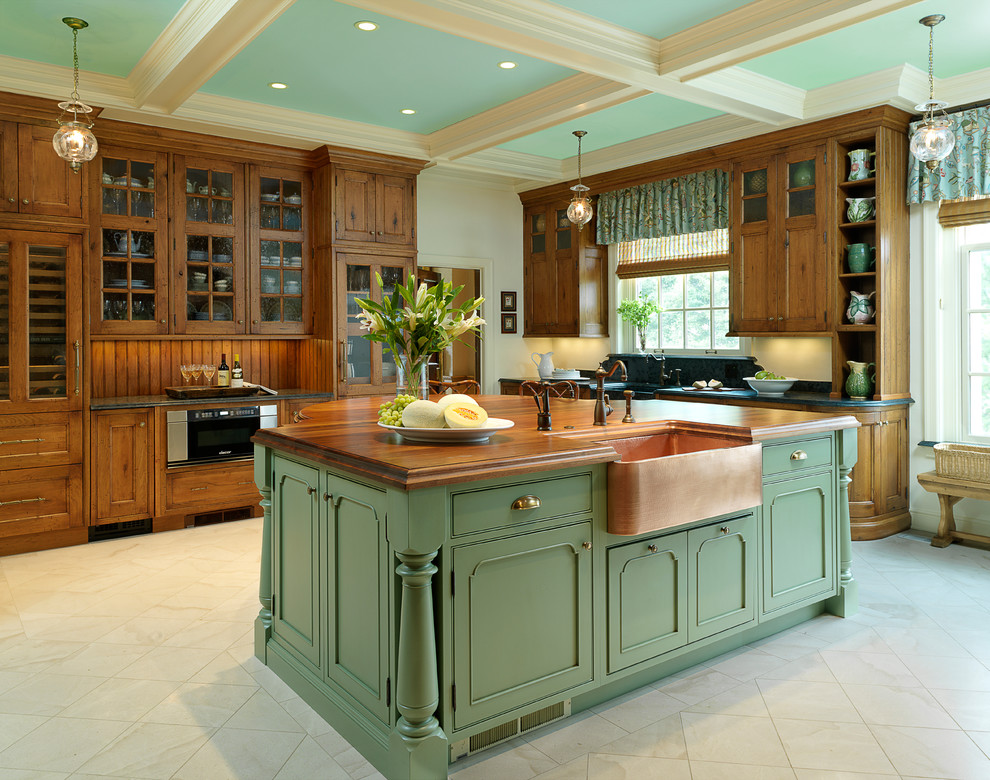 Example of a classic kitchen design in St Louis with beaded inset cabinets, a farmhouse sink, wood countertops and green cabinets