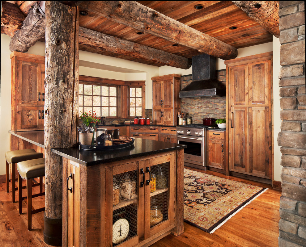 Inspiration for a mid-sized rustic u-shaped medium tone wood floor kitchen remodel in Detroit with shaker cabinets, medium tone wood cabinets, multicolored backsplash, matchstick tile backsplash, stainless steel appliances, a peninsula and solid surface countertops