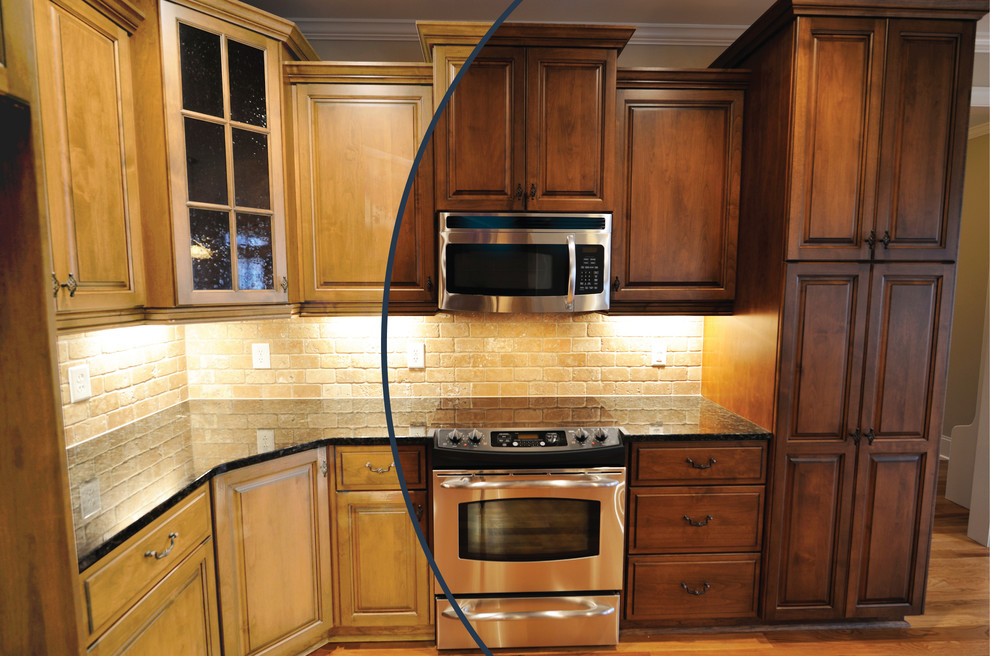 Example of a mid-sized trendy l-shaped medium tone wood floor kitchen pantry design in Los Angeles with dark wood cabinets, granite countertops and terra-cotta backsplash