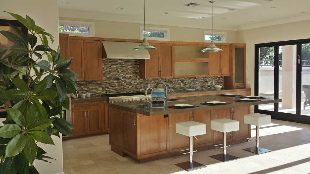 Large trendy single-wall cement tile floor and beige floor enclosed kitchen photo in Orange County with a double-bowl sink, shaker cabinets, light wood cabinets, concrete countertops, multicolored backsplash, matchstick tile backsplash, stainless steel appliances and an island