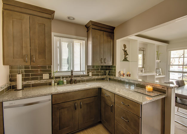 Photo of a small traditional enclosed kitchen in Chicago with a submerged sink, shaker cabinets, medium wood cabinets, granite worktops, brown splashback, glass sheet splashback, white appliances and a breakfast bar.