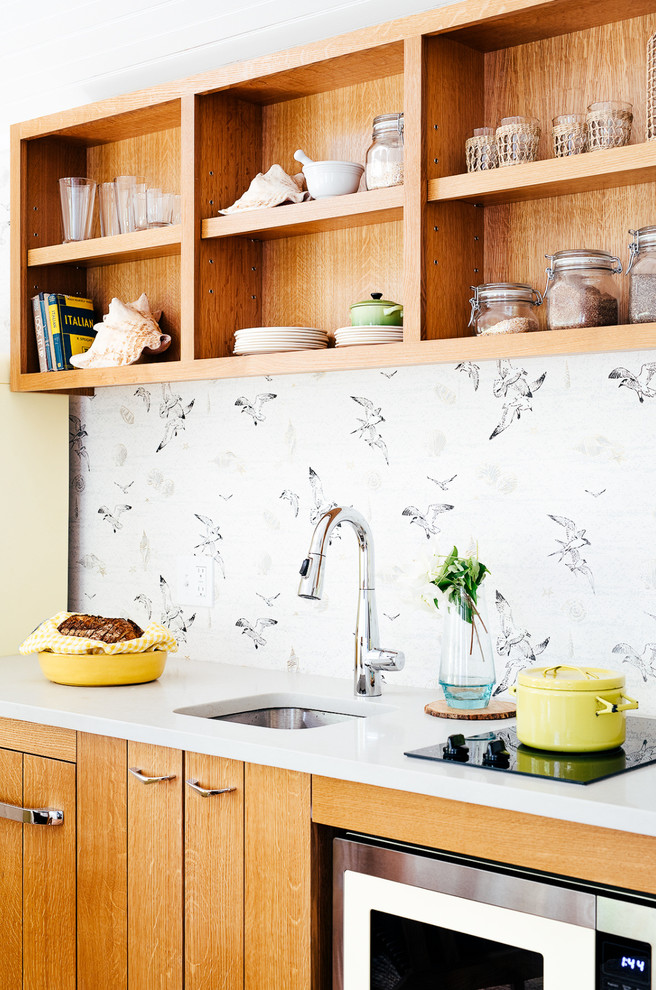 Inspiration for a small coastal single-wall medium tone wood floor kitchen remodel in Portland Maine with an undermount sink, flat-panel cabinets, medium tone wood cabinets, colored appliances and white countertops