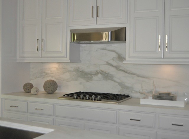 This is an example of a classic kitchen in Atlanta with raised-panel cabinets, white cabinets, marble worktops, white splashback and marble splashback.