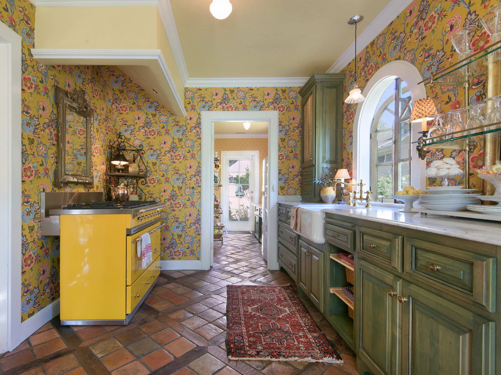 Example of a mid-sized tuscan galley terra-cotta tile kitchen design in Sacramento with a farmhouse sink and marble countertops