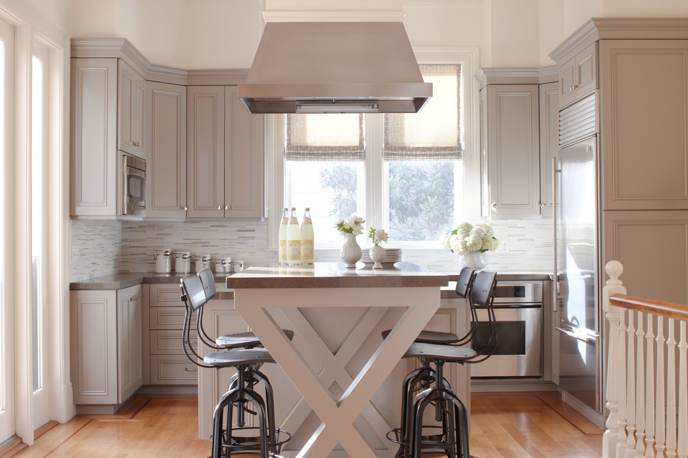 Trendy eat-in kitchen photo in San Francisco with recessed-panel cabinets and gray cabinets