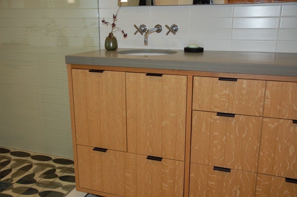 Photo of a medium sized retro galley enclosed kitchen in San Francisco with a submerged sink, flat-panel cabinets, white cabinets, marble worktops, stainless steel appliances, slate flooring and no island.