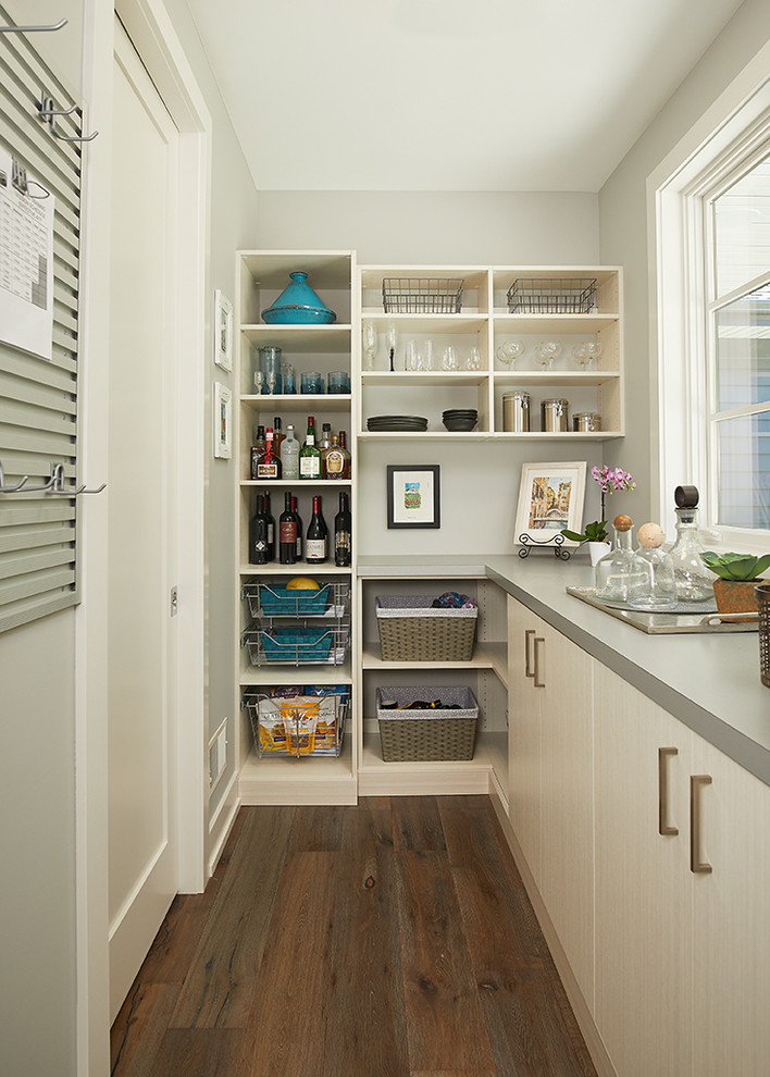 Eat-in kitchen - modern l-shaped medium tone wood floor and brown floor eat-in kitchen idea in Grand Rapids with an undermount sink, flat-panel cabinets, white cabinets, quartz countertops, gray backsplash, ceramic backsplash, stainless steel appliances and an island