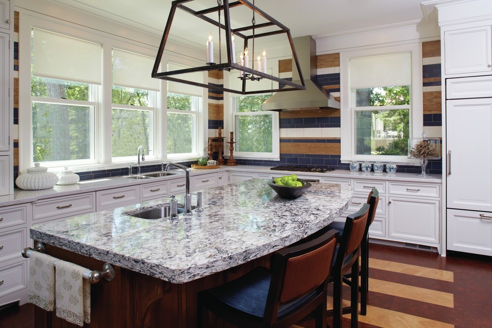 Kitchen - transitional l-shaped kitchen idea in Richmond with a double-bowl sink, recessed-panel cabinets, white cabinets, quartzite countertops, blue backsplash, porcelain backsplash, stainless steel appliances and an island