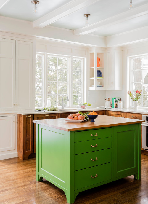 Bright best kitchen cabinet colors Canada featuring a bold green island cabinet with wood countertop, paired with classic white shaker cabinets and natural wood base cabinets, highlighting one of the best kitchen cabinet color trends in Canada.
