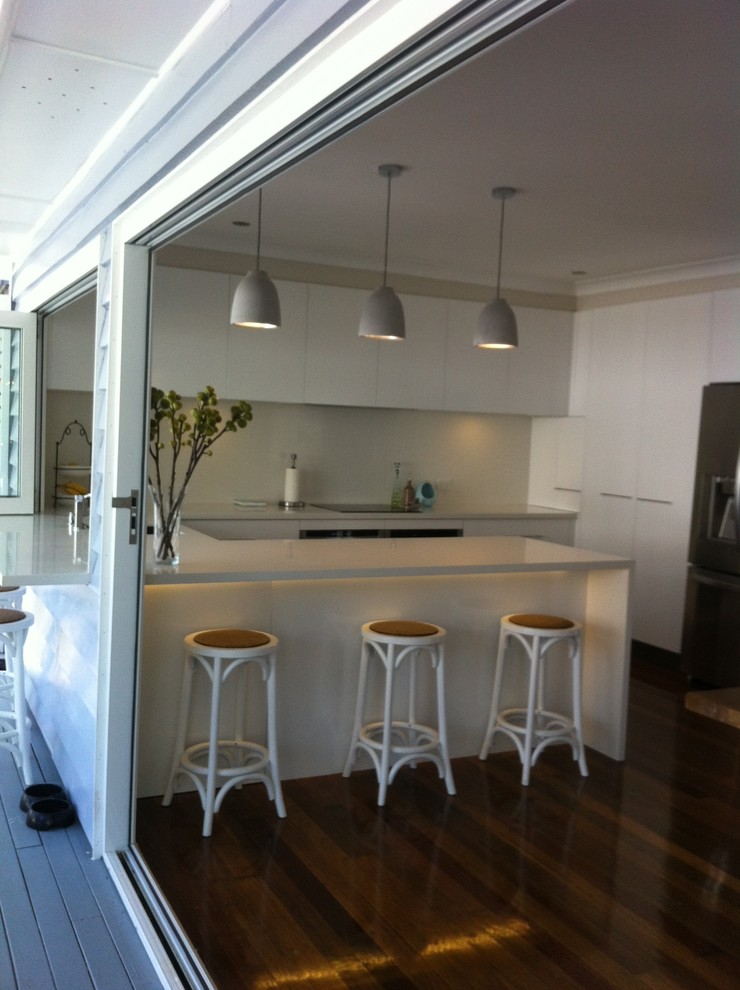 Kitchen - coastal kitchen idea in Brisbane