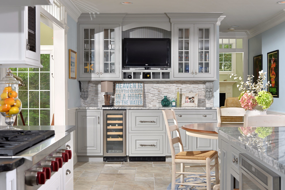 Inspiration for a coastal eat-in kitchen remodel in New York with raised-panel cabinets, gray cabinets, white backsplash and stainless steel appliances