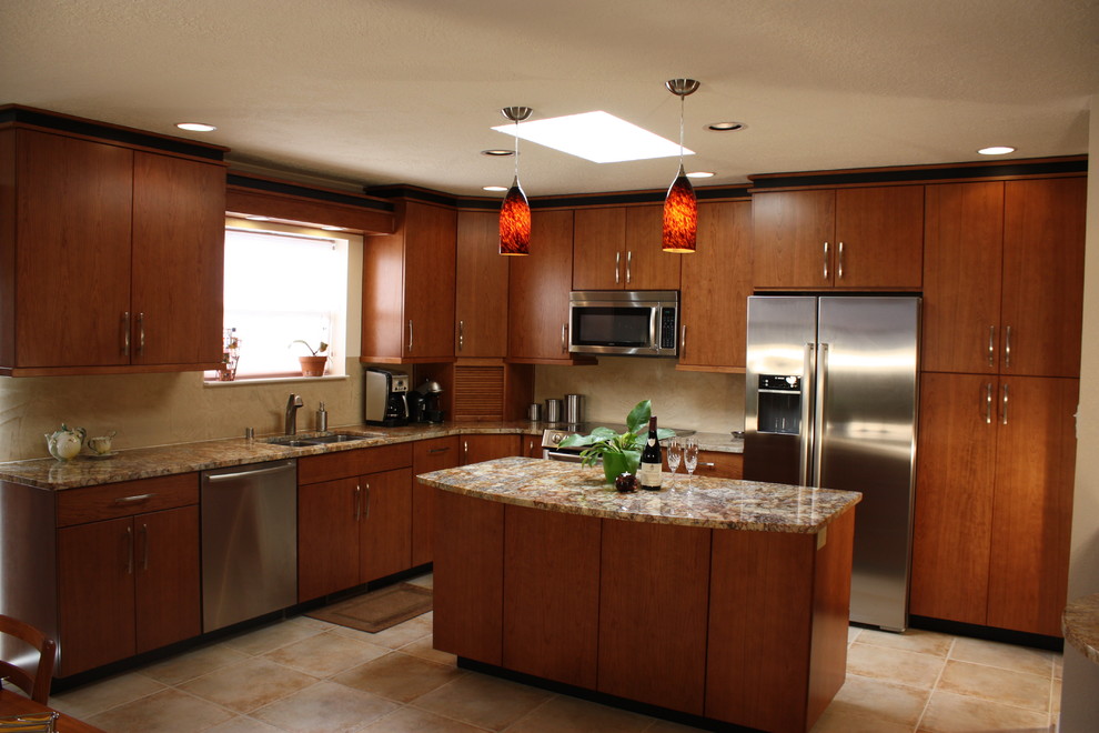 Contemporary u-shaped kitchen/diner in Albuquerque with a submerged sink, flat-panel cabinets, granite worktops, beige splashback, stainless steel appliances, medium wood cabinets, an island and beige worktops.