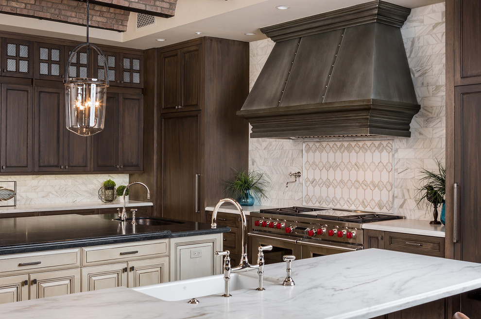 Example of a huge tuscan u-shaped beige floor open concept kitchen design in Phoenix with a farmhouse sink, recessed-panel cabinets, dark wood cabinets, marble countertops, multicolored backsplash, marble backsplash, stainless steel appliances, two islands and multicolored countertops